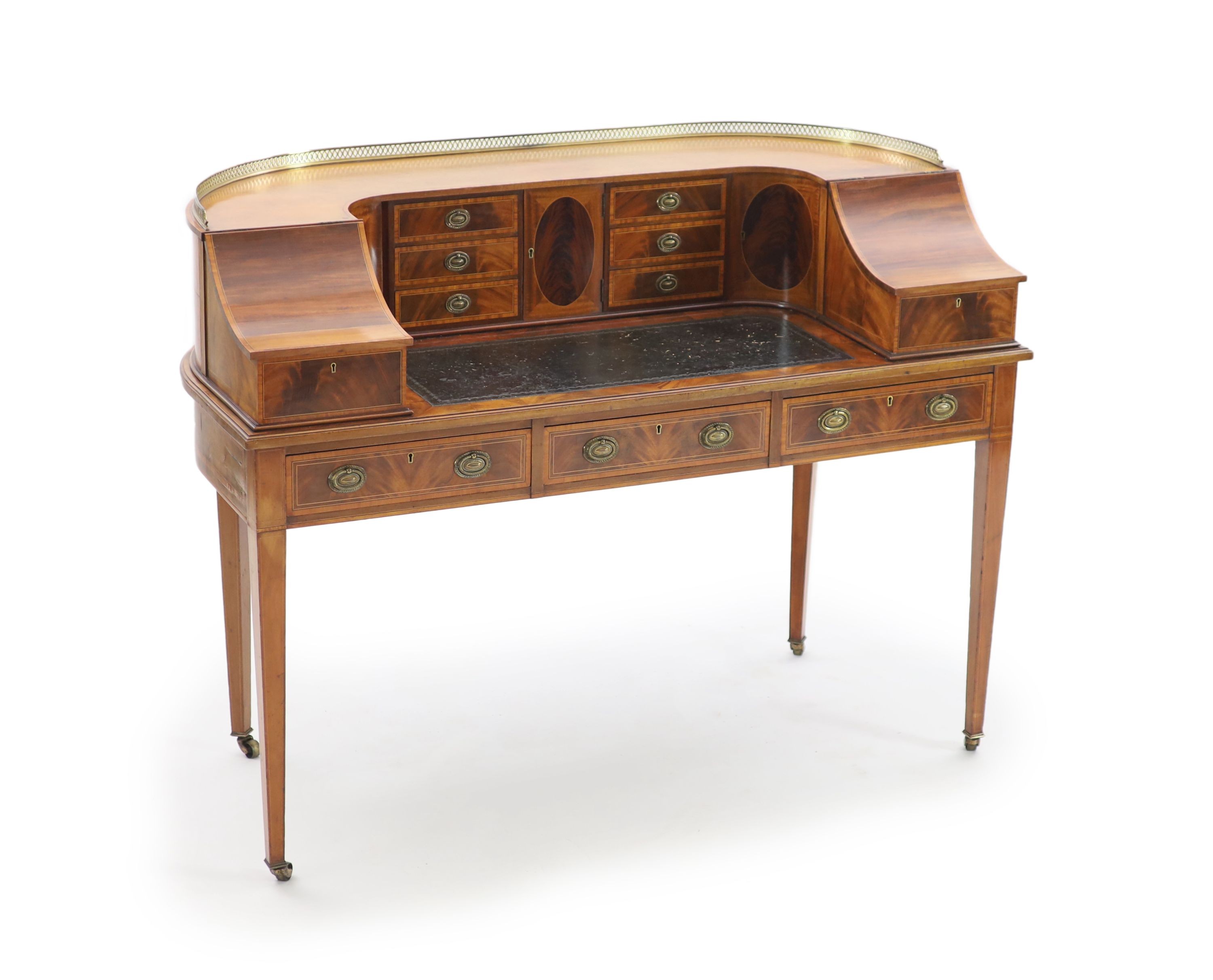 An Edwardian Sheraton revival satinwood banded mahogany Carlton House desk, W.138cm D.65cm H.104cm